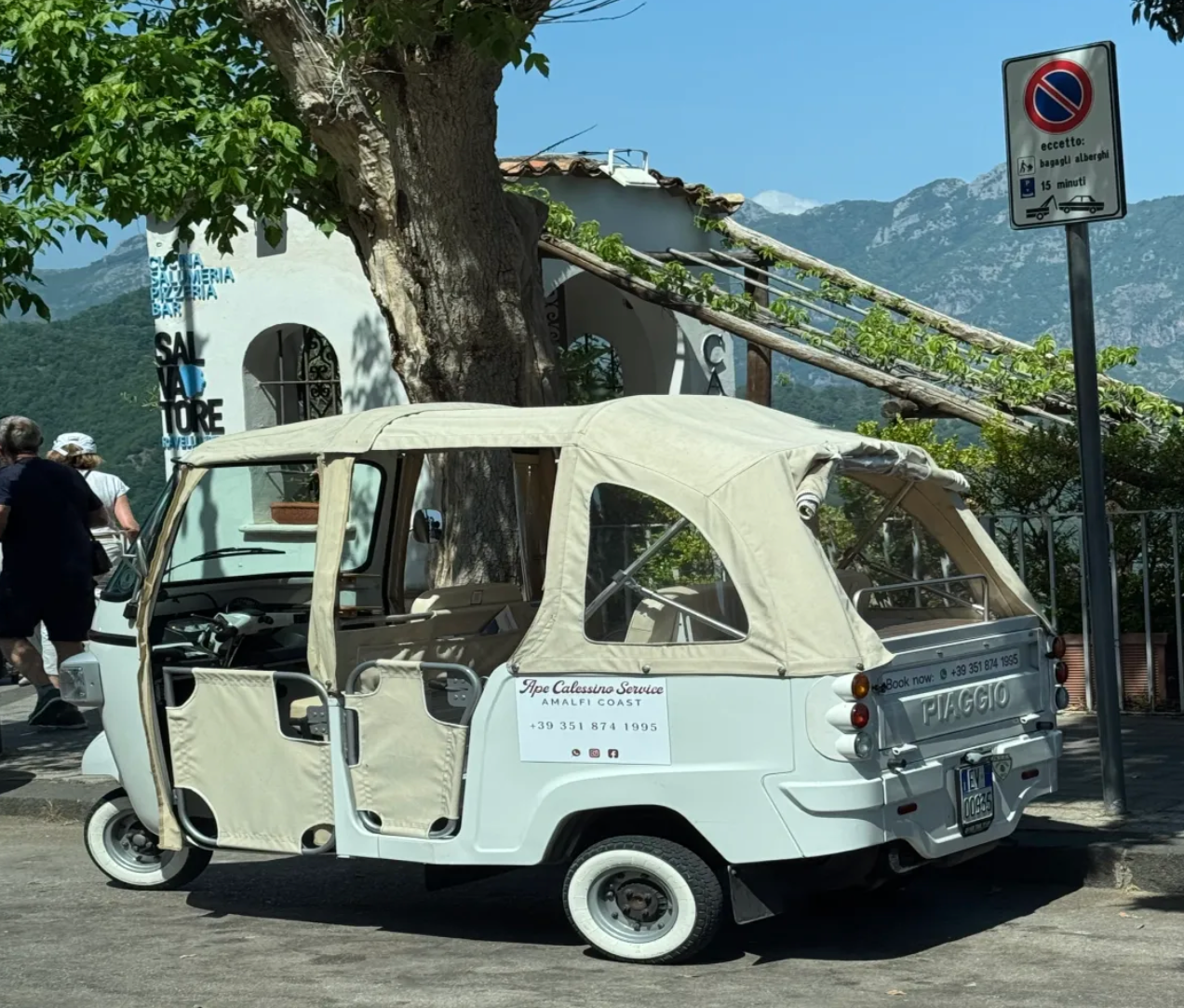 White Piaggio tuk-tuk on the Amalfi Coast Italy