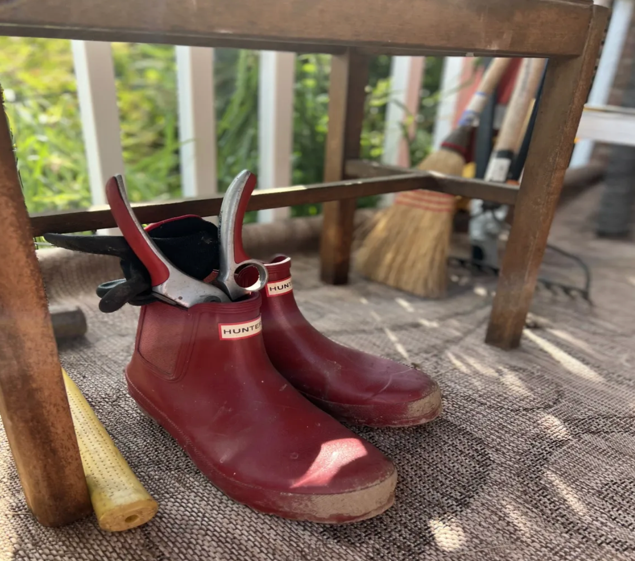 Red Hunter boots with boot jack lifestyle