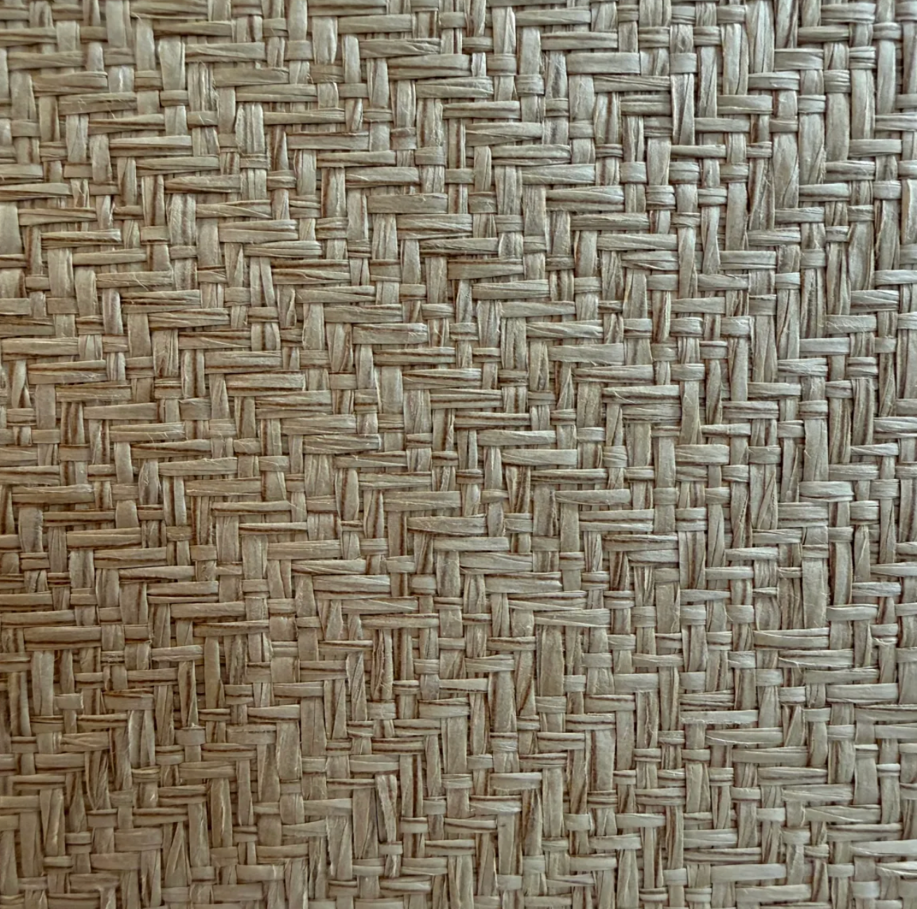 Woven straw herringbone pattern texture