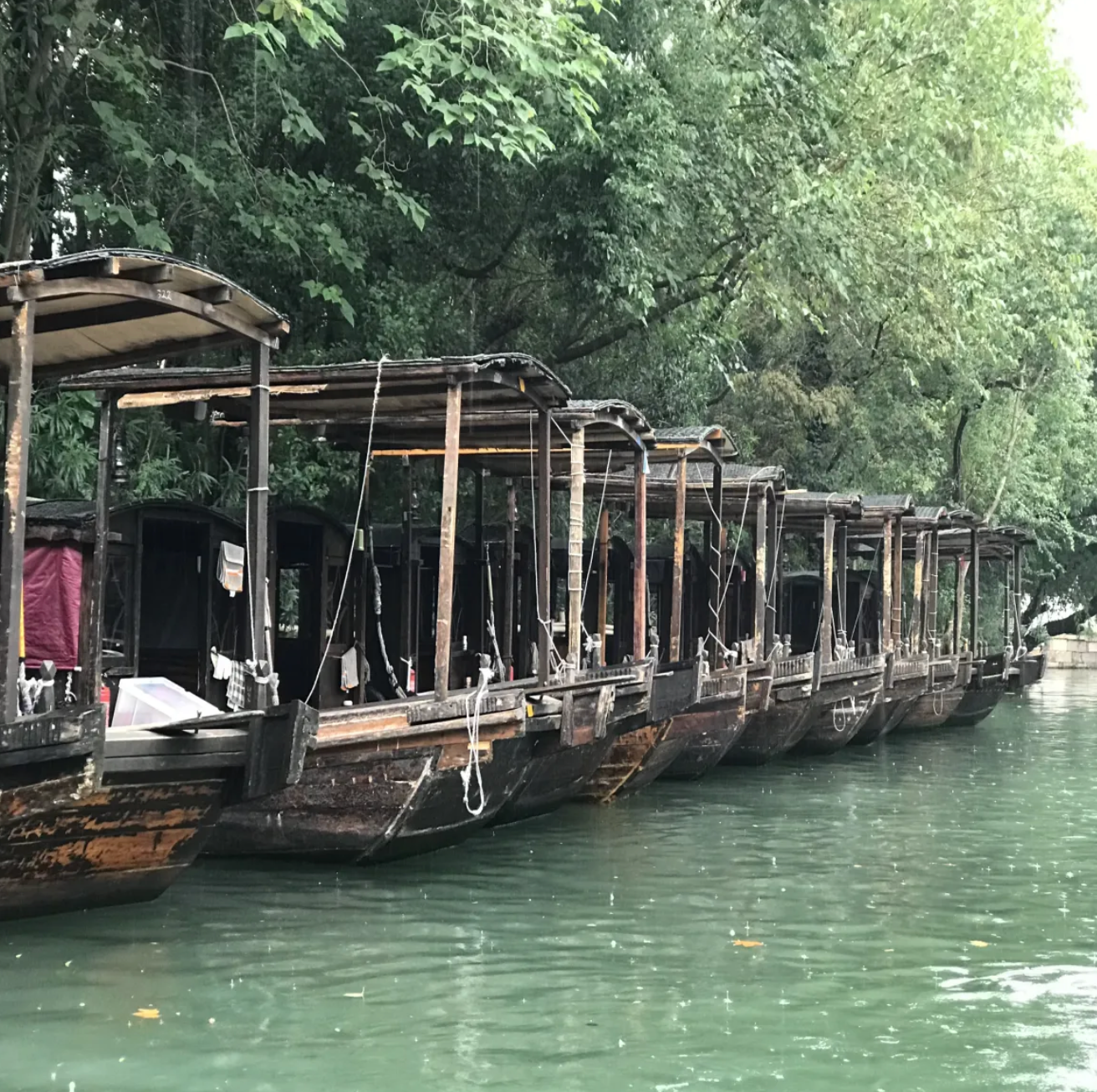 Traditional wooden boats moored along a canal