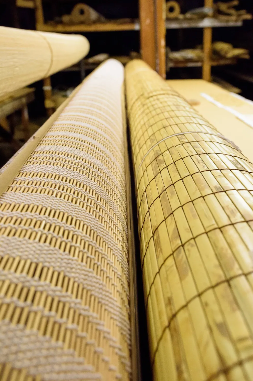 Woven textile rollers on loom machine