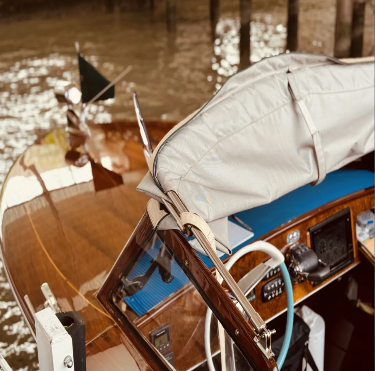 Vintage boat with white canvas cover