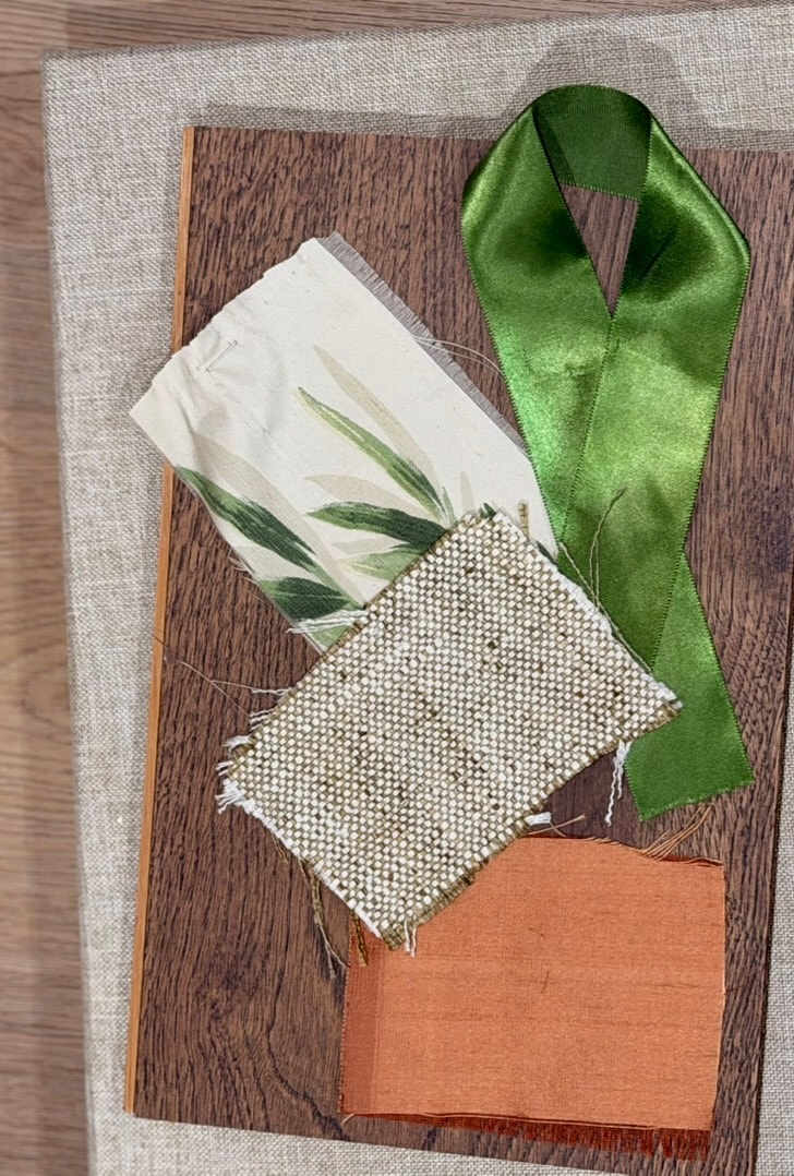 Fabric swatches with greenery flat lay