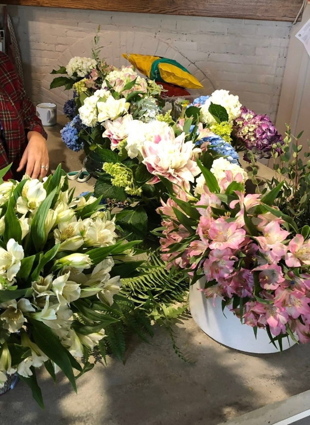 White pink and blue floral arrangements bridal shower